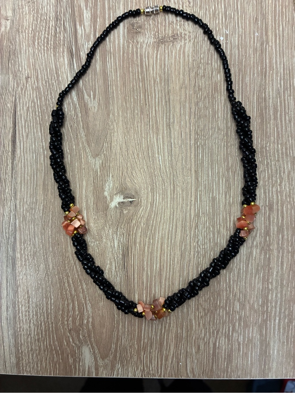 Handcrafted Black Beaded Necklace with Coral Accent
